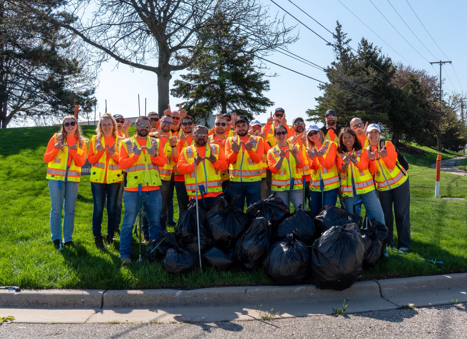 Wolverine Construction team members during a companywide roadside cleanup as part of Wolverine IMPACT.